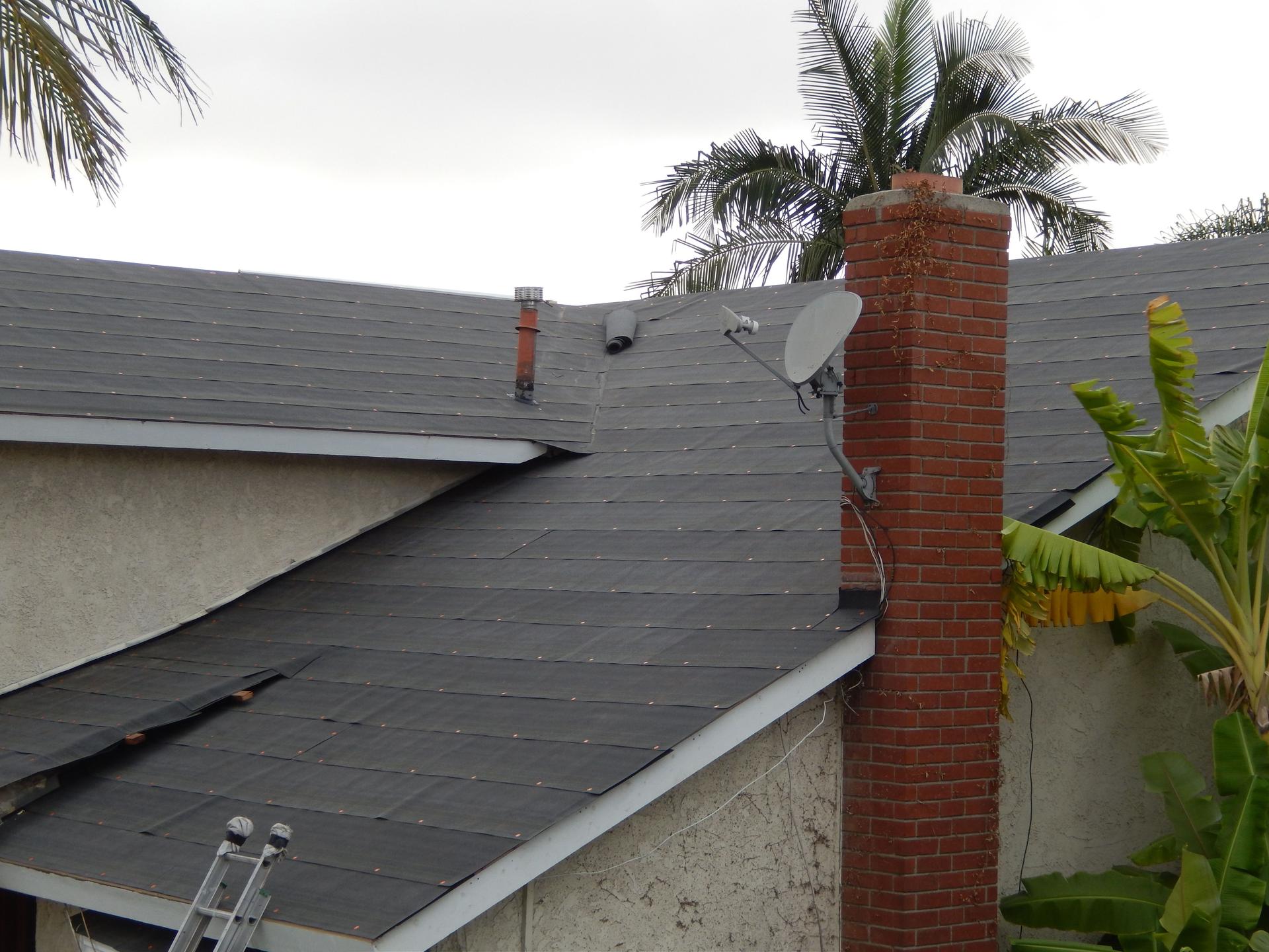 Tar paper before installing roof on the house